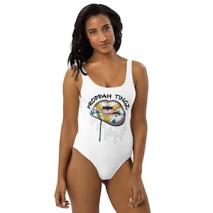 One-Piece Swimsuit: White. Virgin Islands flag lip design. Brand name- black.