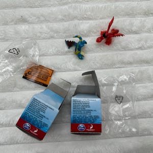 Dreamworks S1 Mystery Dragon Box Hookfang and Stormfly How To Train Your Dragon approx. 5 cm Damaged Boxes Please see pictures