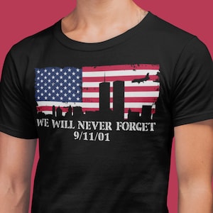 We Will Never Forget 9/11 with an image of a Distressed American flag and the Twin Towers T-shirt