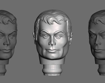 May include: Three gray plastic male head sculptures with short hairstyles. The heads are mounted on short, cylindrical bases.
