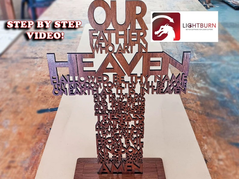 May include: A wooden cross-shaped art piece with the Lord's Prayer cut out in the wood. The words "Our Father" and "Heaven" are prominently displayed. The Lightburn logo is in the upper right corner. The words "Step by Step Video!" are in the upper left.