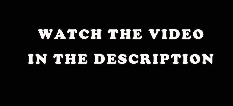 May include: Black background with white text that reads "WATCH THE VIDEO IN THE DESCRIPTION". The text is in a bold, sans-serif font. The image is simple and direct, conveying a clear message.