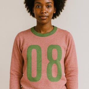 Knitted crew neck sweater. Pink knit pullover |