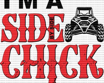May include: Red and black graphic text that reads "I'm a Side by Side Chick" with a black and white illustration of a side-by-side vehicle.