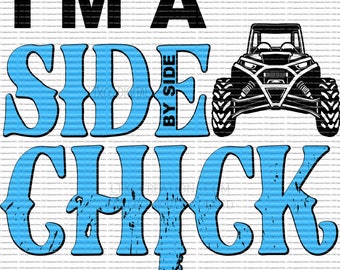 May include: A blue and black graphic design with the text "I'm a Side by Side Chick". The graphic features a black and white illustration of a side-by-side vehicle.