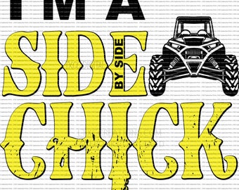 May include: A yellow and black graphic design with the text "I'm a side by side chick". The design features a black and white illustration of a side-by-side vehicle.