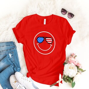 American Flag Smiley Face t-shirt July 4th Graphic T for Kids Smile Shirt with Shades Stars and Stripes Design with Smiling Face