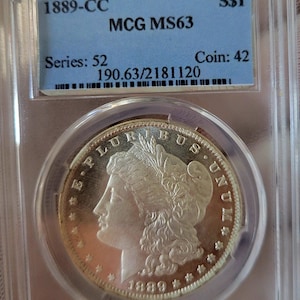 Dólar de plata Morgan de 1889-CC, 90%, Ms63 con certificado de autenticidad.