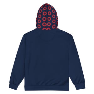 May include: Navy blue hoodie with a red circular pattern on the hood's interior. The hoodie has a solid navy blue exterior, a drawstring, and a kangaroo pocket. This casual sweatshirt is suitable for everyday wear.