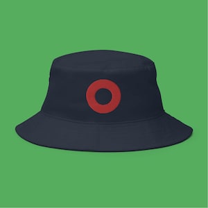 May include: A navy blue bucket hat with a red circle on the front.