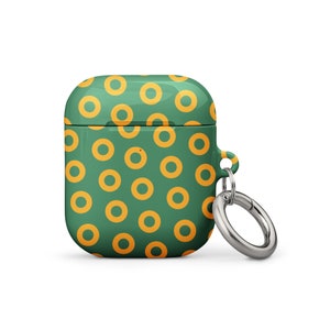 Peut inclure: &Eacute;tui pour AirPod vert et jaune avec un motif de beignets et un porte-cl&eacute;s argent&eacute;.