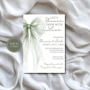 Pode incluir: Um cartão de convite branco com um laço verde sálvia em aquarela e texto. O texto diz "Let's Shower Them With Love" e inclui detalhes do evento para Olivia & Josh, incluindo data, hora e local. O convite está registrado na Target & Amazon.