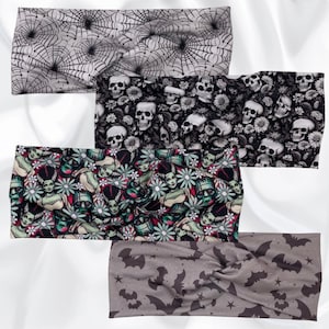 May include: Set of four Halloween-themed headbands. The headbands are made of fabric and feature different patterns, including skulls, bats, and a monster. The headbands are a fun and festive way to accessorize for Halloween.