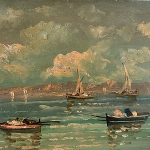 Oil painting on hardboard featuring fishing boats on the bay signed