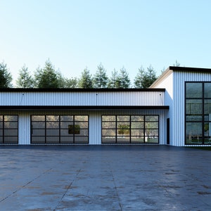 May include: Modern white building with three garage doors and a large glass window section. The building has a black roof and trim, set against a backdrop of green trees and a blue sky. The driveway is concrete.