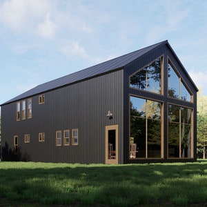 May include: A contemporary two-storey house with a black exterior and a steeply pitched roof. Large windows offer views of the surrounding trees and sky. The house is set on a grassy lawn.