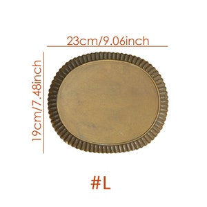 May include: A large, round, gold-colored serving tray with a scalloped edge. The tray measures 9.06 inches in diameter and 7.48 inches in height. #L