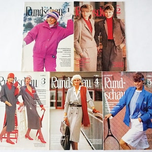 May include: Five magazines with the title "Rundschau" and a number from 1 to 5. Each magazine features a different model wearing various outfits. The magazines are for international women's fashion.