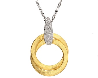 May include: A silver chain necklace with a gold and silver pendant. The pendant is two interlocking circles with a textured finish. The top of the pendant is a silver teardrop shape with a textured finish.