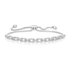 May include: A silver-toned bracelet with a chain-link design. The links are rectangular and encrusted with small, clear gemstones. The bracelet has an adjustable clasp and a delicate chain.