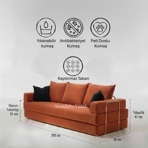 May include: An orange corduroy sofa with black throw pillows. The sofa is 200 cm long, 90 cm wide, and 47 cm high. The seat height is 32 cm. The text "Anadolu Yatak" is visible on the sofa.