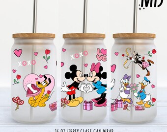 May include: Three 16 ounce glass can wraps featuring Mickey Mouse and Minnie Mouse, Goofy, and Donald Duck. The wraps are designed for Valentine's Day and feature hearts, XOXO, and the word "Love".