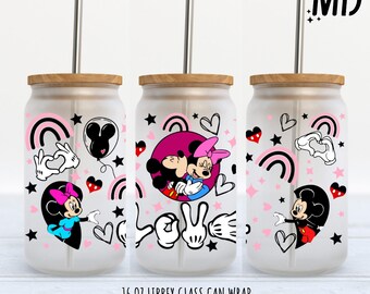 May include: A frosted glass can wrap featuring Mickey and Minnie Mouse designs. The wrap includes images of Mickey and Minnie Mouse, hearts, rainbows, and the word "LOVE". The can wrap is designed for a 16 oz Libbey glass can.