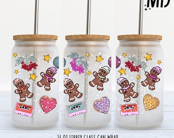 May include: Three 16 ounce frosted glass can wraps with a winter holiday theme. The design features gingerbread men, snowflakes, stars, and a cassette tape. The wraps are ready to be applied to a glass can.