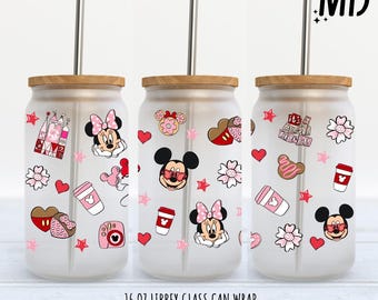 May include: Three 16 ounce glass can wraps with a pink and white design featuring Mickey Mouse and Minnie Mouse characters, hearts, stars, and other Disney-themed graphics. The text "it's a small world" is featured on one of the wraps.