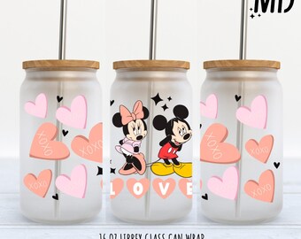 May include: A set of three 16 ounce glass can wraps featuring Mickey and Minnie Mouse in a Valentine's Day theme. The wraps feature pink and red hearts with the word "LOVE" and "XOXO" printed on them. The wraps are designed to fit 16 ounce Libbey glass cans.