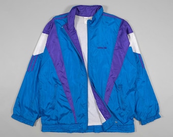 Chaqueta deportiva Adidas de los 90 con logotipo bordado (azul/morado). Tallas M, L y XL.