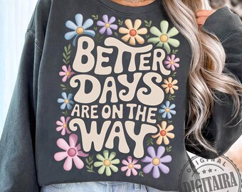 May include: A dark gray sweatshirt with a floral design and the text "Better Days Are On The Way" in a retro font.