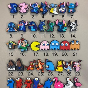 May include: A set of 37 colourful shoe charms featuring various cartoon characters, including Stitch, Pac-Man, Yoda, and more. The charms are numbered 1 through 37.