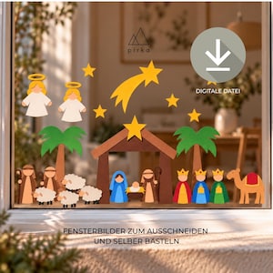 May include: A set of paper cutouts for a nativity scene displayed on a window, featuring angels, shepherds, sheep, palm trees, a stable, a star, and three kings with a camel. Text includes pirka, a download icon, DIGITALE DATEI, and FENSTERBILDER ZUM AUSSCHNEIDEN UND SELBER BASTELN.