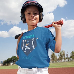 Lil&#39; Dumper Kids fan gear of Cal Raleigh &quot;Big Dumper&quot; . Heavy Cotton Tee