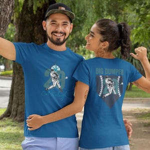 Introducing the one-of-a-kind Big Dumper/CAL RALEIGH Double-Sided Unisex Heavy Cotton Tee.