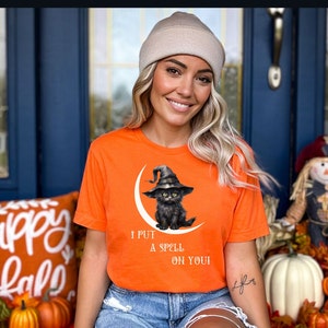 Cute Cat Halloween T-shirt Black Cat Witchy Moon Spooky Season gift for Halloween Witches Cat Lovers Magical Spell  for Witches Unisex Tee