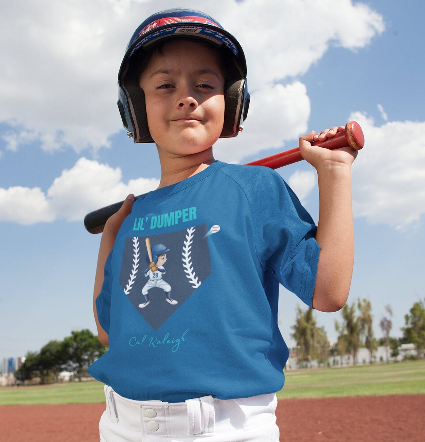 Lil' Dumper Kids fan gear of Cal Raleigh "Big Dumper" . Heavy Cotton Tee