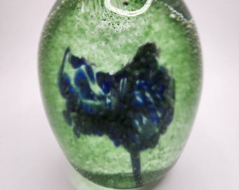 Green with blue flower glass paperweight