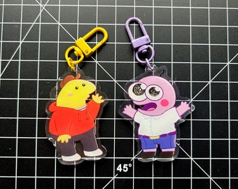 Llaveros con dijes de doble cara de los amigos sonrientes Charlie y Pim