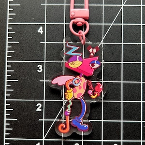 The Amazing Digital Circus Charms (double sided) (Pomni, Jax, Ragatha, Kinger, Zooble, Gangle, and Caine) Zooble
