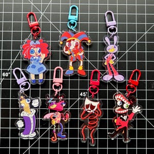 The Amazing Digital Circus Charms (double sided) (Pomni, Jax, Ragatha, Kinger, Zooble, Gangle, and Caine)