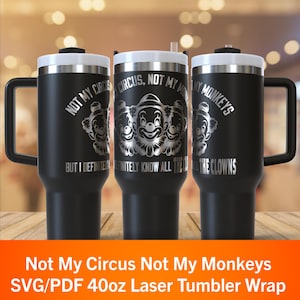 May include: Black 1183ml tumbler with a white lid and handle. The tumbler features the text "NOT MY CIRCUS, NOT MY MONKEYS" and a graphic of three clowns. The text "BUT I DEFINITELY KNOW ALL THE CLOWNS" is also included.