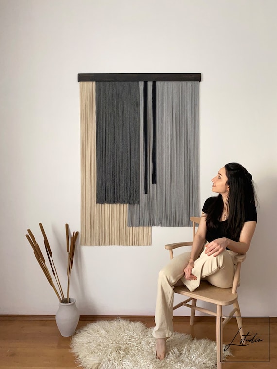 Hanging tapestry on concrete wall hotsell