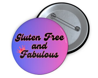 May include: A purple and pink gradient button with the text "Gluten Free and Fabulous" in black with a pink crown above the word "Fabulous".