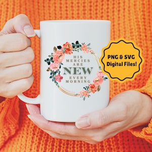 May include: White ceramic mug with a floral wreath design and the text "His mercies are new every morning, Lamentations 3:23".