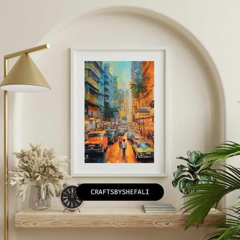 May include: A framed art print depicting a vibrant street scene with cars and pedestrians. The artwork features a warm color palette of oranges, yellows, and blues, with palm trees lining the street. The text "CRAFTSBYSHEFALI" is visible on the frame.