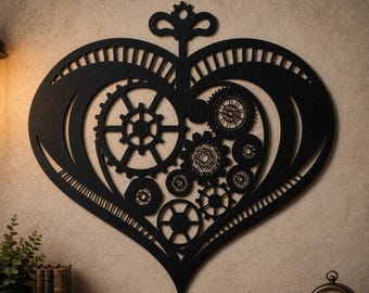 May include: A black heart-shaped wall decoration featuring an intricate cutout design of various mechanical gears and cogs. The piece includes a decorative top element resembling a clock winding key, with a symmetrical frame and openwork patterns.
