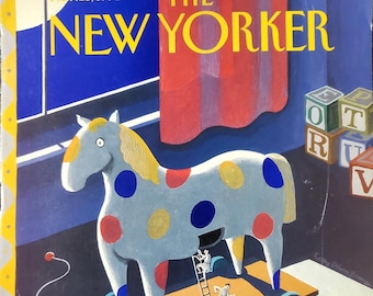 May include: A vintage New Yorker magazine cover illustration featuring a large, gray, polka-dotted rocking horse with a red, yellow, and blue color scheme.  The horse is on a wooden platform with wheels and a rope attached to the front.  There are small figures of people climbing on the horse and running alongside it.  The magazine cover text reads "The New Yorker" and "Nov. 25, 1991".