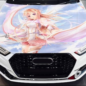 May include: A white car with a black grille and a large anime-style graphic on the hood. The graphic features a female character with long pink hair and a white dress, holding a sword.